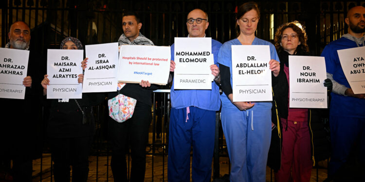 Demands for permanent Gaza ceasefire at British vigil for slain medical workers |  Israelo-Palestinian conflict