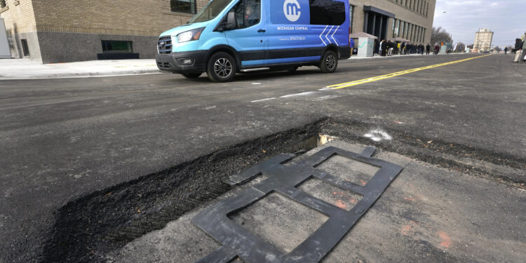 New technology installed under Detroit street can charge electric vehicles while they drive