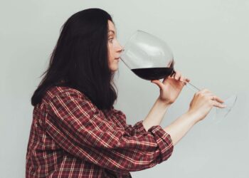 Why do some people get a headache when drinking red wine?