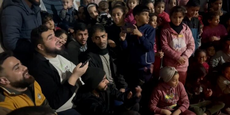 A prophetic praise session for children inside a school to shelter displaced people in central Gaza  News