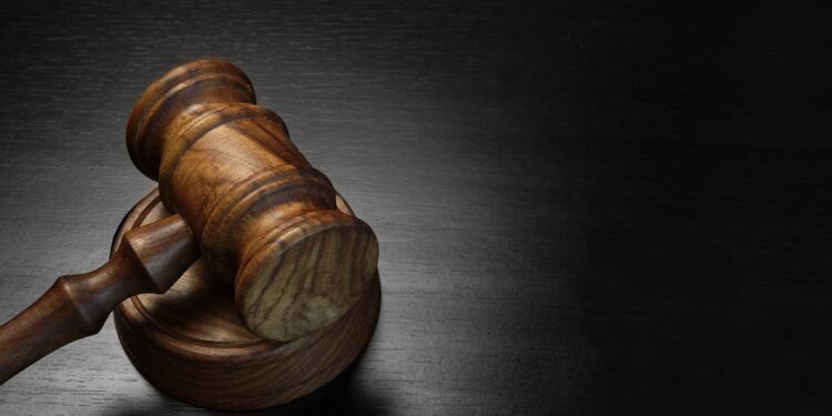 Conviction for negligence of the mother of an American student who shot his teacher