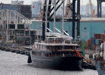 IN PICTURES |  Too big for the marina, Jeff Bezos’ gigantic yacht must be anchored among oil tankers and cruise ships