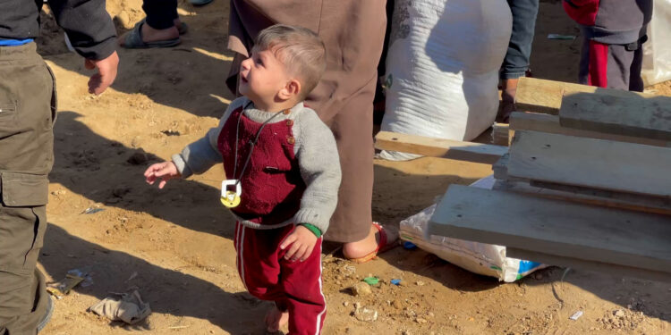 Families are forced to leave their tents near a hospital in the central Gaza Strip