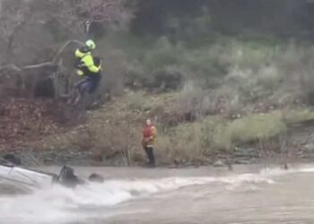 Woman rescued after 15 hours trapped on her submerged car
