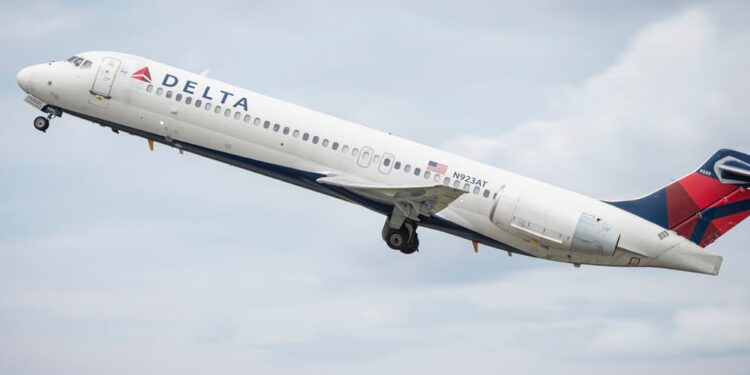 Man found dead inside Delta plane engine