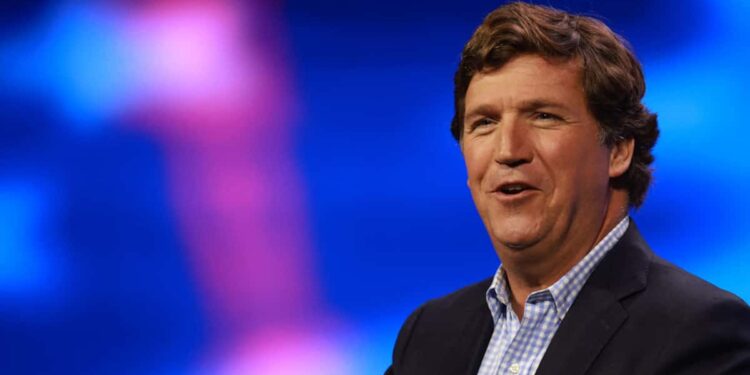 Pierre Poilievre, behind Tucker Carlson and Danielle Smith