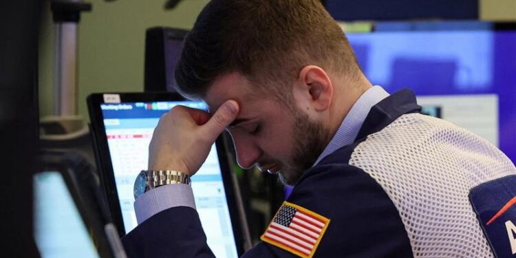 Wall Street sees red, while the economy resists