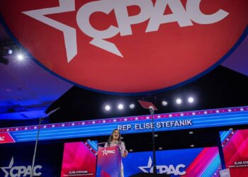 At the high mass of American conservatives, Trump and Biden candy as Nazis