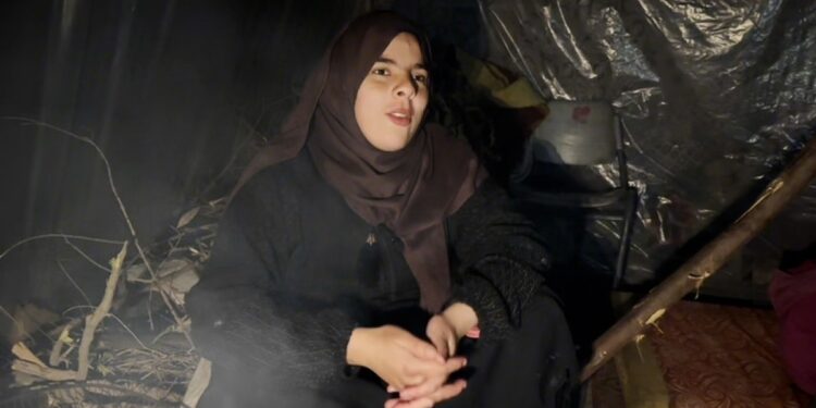 In the midst of a dilapidated tent and harsh conditions, a Palestinian woman finds nothing to welcome her newborn