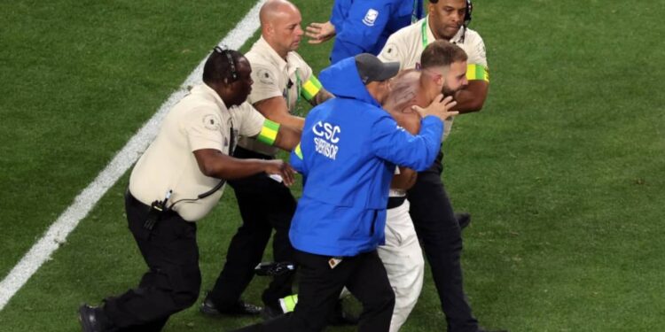 Two men were arrested after stripping while running onto the field during the Super Bowl