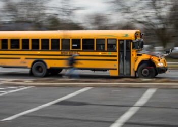 Driver accused of setting fire to bus with children on board