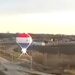 Hot air balloon causes fire when it crashes into electrical wires above highway