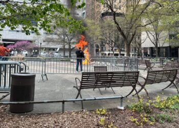 (IMAGES) Person attempts to set himself on fire outside Trump court