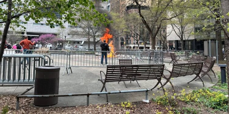 (IMAGES) Person attempts to set himself on fire outside Trump court