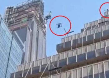 ON VIDEO |  An individual throws a wooden chair from the top of a multi-story building