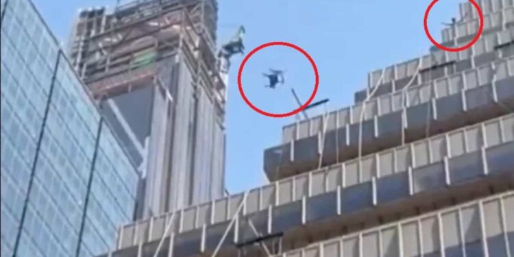 ON VIDEO |  An individual throws a wooden chair from the top of a multi-story building