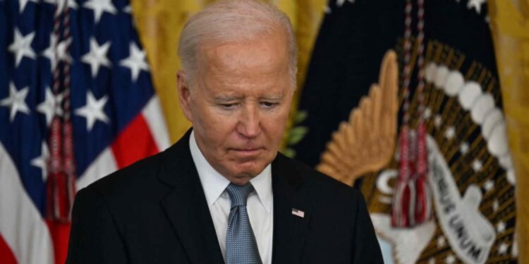 Tense national holiday for Biden, in the midst of a crisis over his candidacy