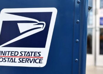 Postman throws mail into dumpsters