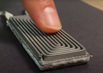 A stretchable, wearable device that lights an LED using only skin heat