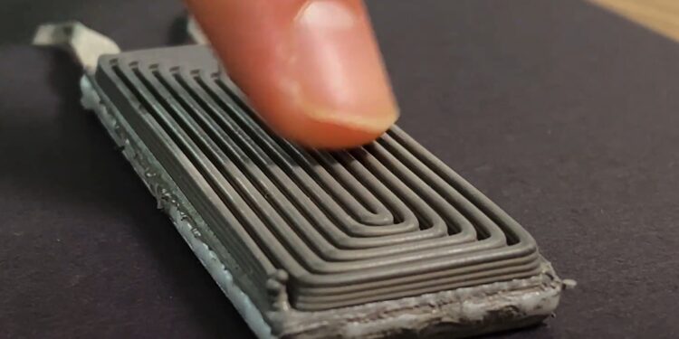 A stretchable, wearable device that lights an LED using only skin heat