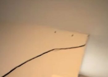 A vehicle driven by a drunk driver drives through the living room of a house