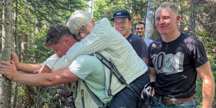 Hiking injury: young soldier saves elderly lady by carrying her on his back
