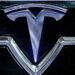 Tesla surprises with a jump in profit