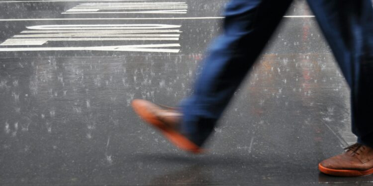 Walk or run in the rain? A physics-based approach to staying dry (or at least drier)