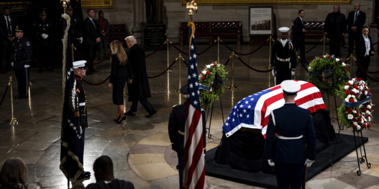 Death of Jimmy Carter | Donald Trump reflects in front of the coffin