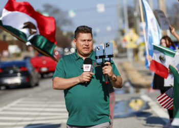 A journalist covering anti-Trump demonstrations threatened with expulsion