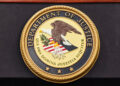 Department of Justice | Competition chief resigns